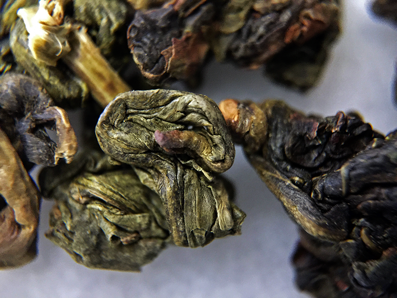 Formosa Jade Oolong (Upton) - loose leaf macro by Jocilyn Mors is licensed under a Creative Commons Attribution-ShareAlike 4.0 International License.