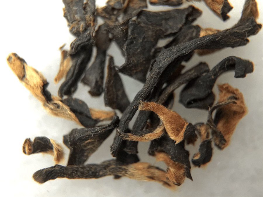 Assam Tongagaon Estate (Arbor) ~ loose leaf macro by Jocilyn Mors is licensed under a Creative Commons Attribution-ShareAlike 4.0 International License.