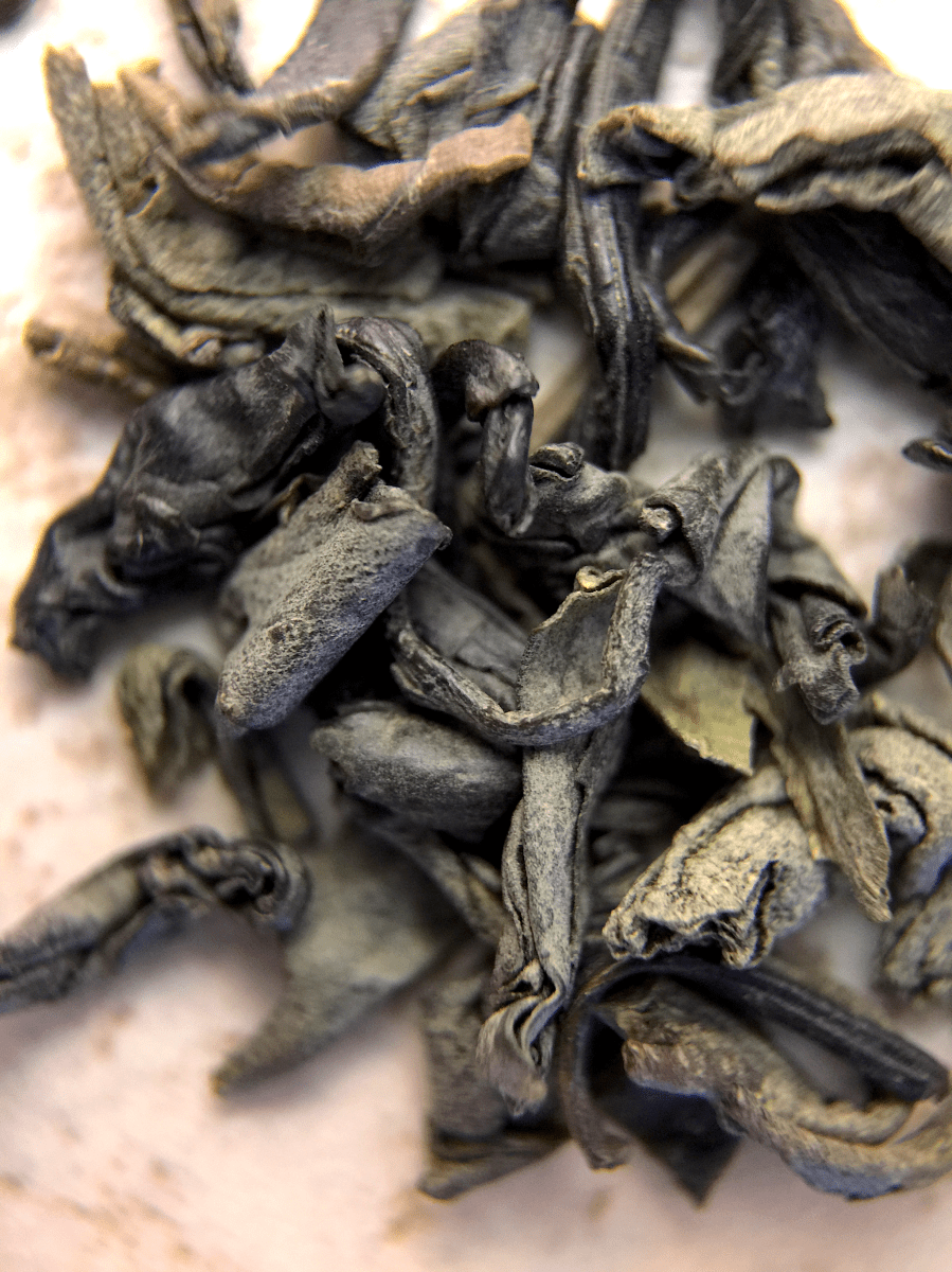 Photograph of Chun Mee (Arbor Teas) ~ loose leaf macro by Jocilyn Mors is licensed under a Creative Commons Attribution-NonCommercial-ShareAlike 4.0 International License.