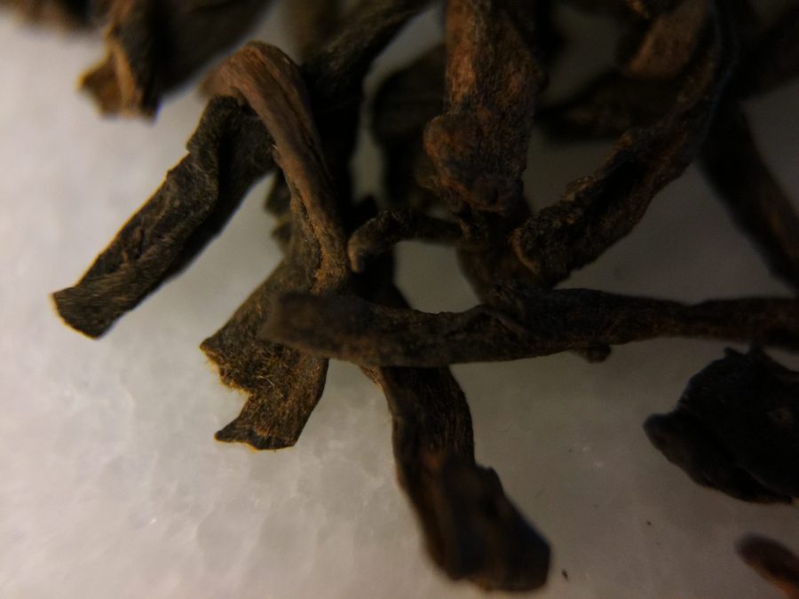 Photograph of China Aged Pu-Erh Celestial Tribute (Upton) ~ loose leaf macro by Jocilyn Mors is licensed under a Creative Commons Attribution-NonCommercial-ShareAlike 4.0 International License.