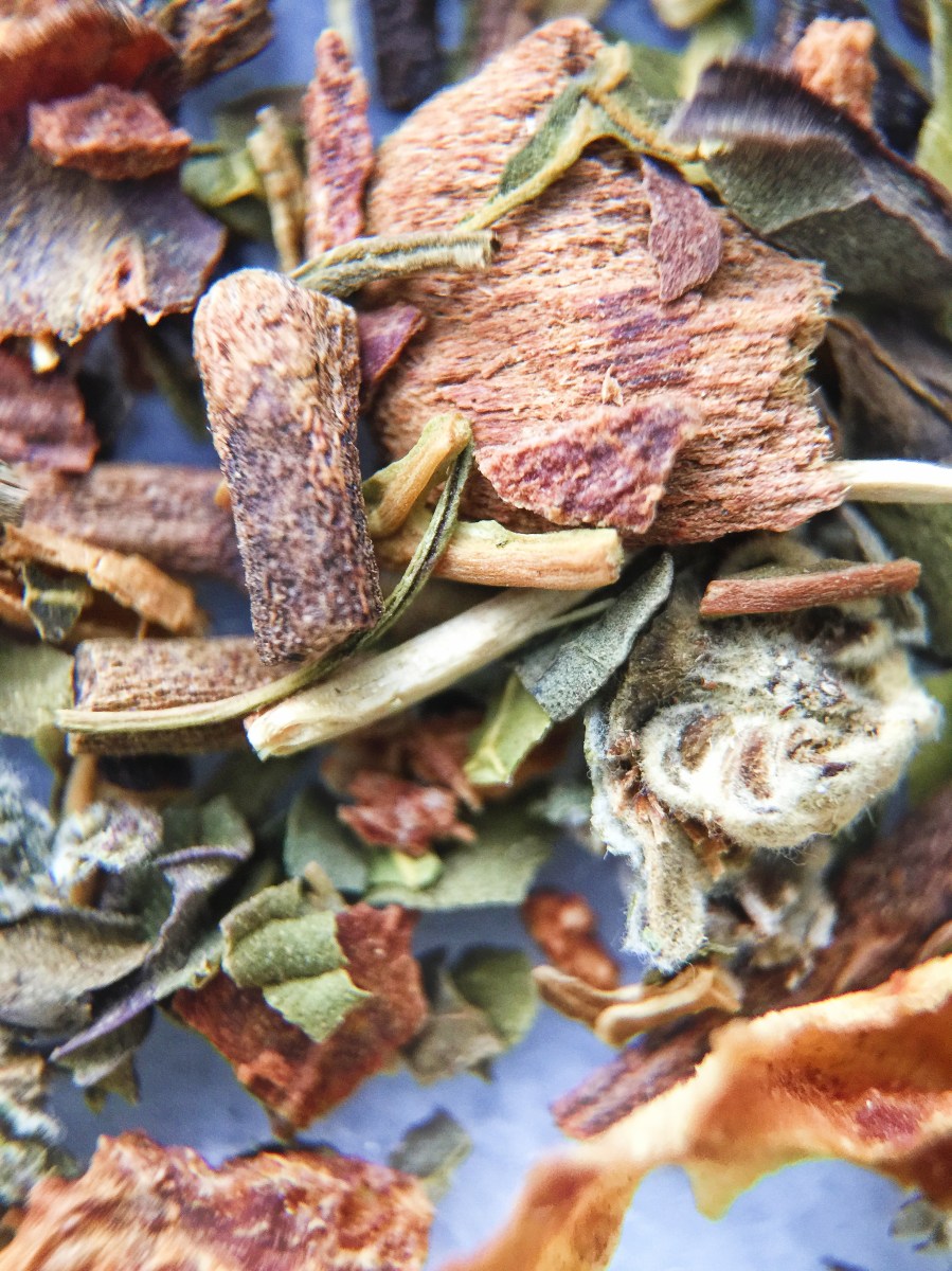 Photograph of Sarsaparilla Summer Herbal (TranquiliTea) ~ loose leaf macro 14x by Jocilyn Mors is licensed under a Creative Commons Attribution-NonCommercial-ShareAlike 4.0 International License.